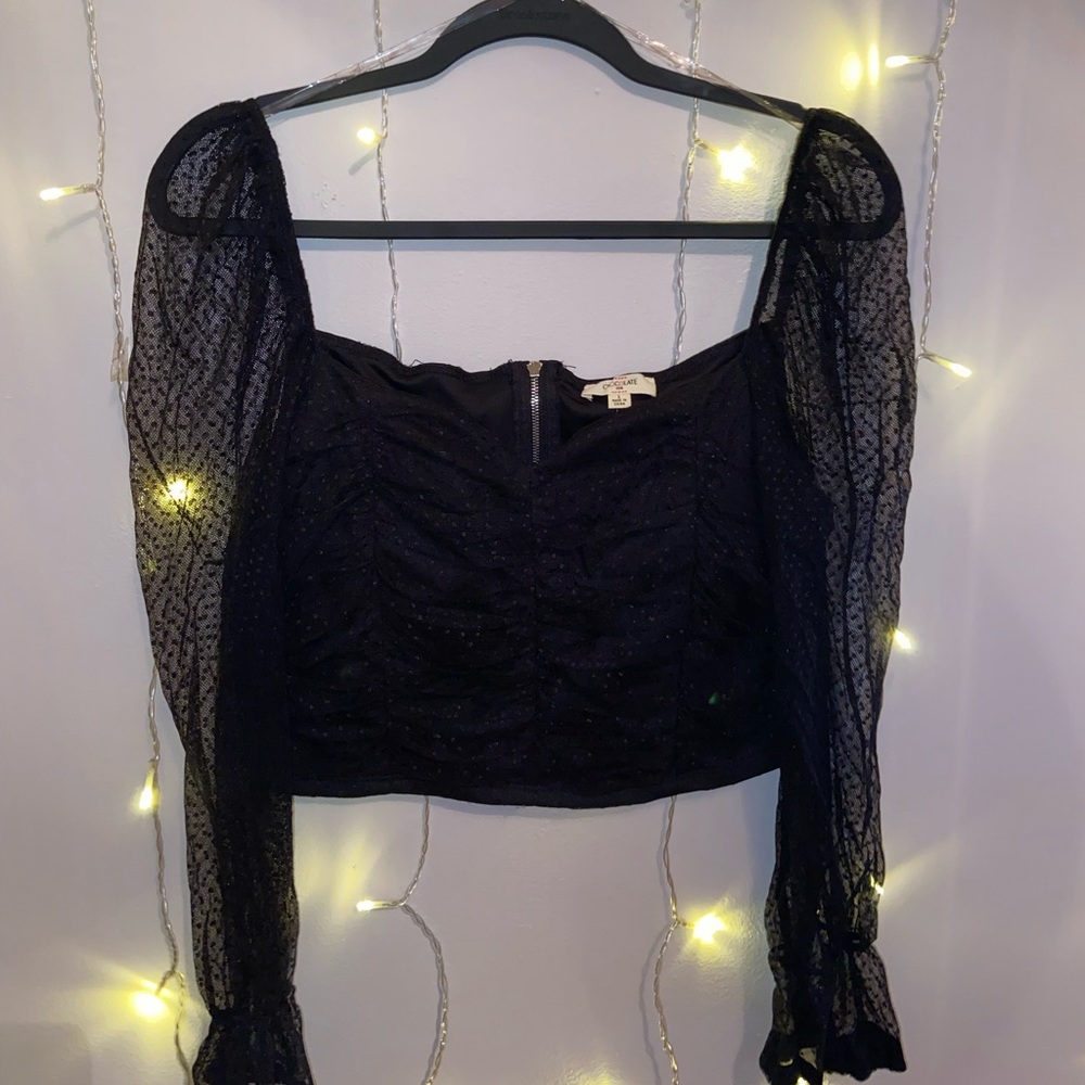 Black going out top
